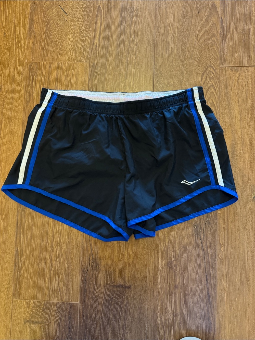 Women’s Saucony Black Athletic Shorts with Blue Trim and White Side Stripes